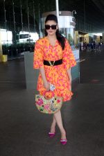 Urvashi Rautela dressed in a pink and orange floral dress spotted at airport on 14 Jun 2023 (10)_6489cf885aa77.jpg