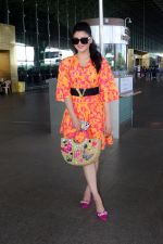Urvashi Rautela dressed in a pink and orange floral dress spotted at airport on 14 Jun 2023 (13)_6489cf8ab2df0.jpg