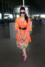 Urvashi Rautela dressed in a pink and orange floral dress spotted at airport on 14 Jun 2023 (16)_6489cf8d174dc.jpg