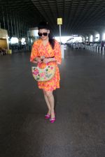 Urvashi Rautela dressed in a pink and orange floral dress spotted at airport on 14 Jun 2023 (3)_6489cf719f63d.jpg