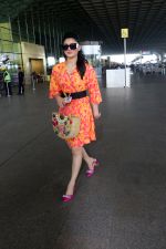 Urvashi Rautela dressed in a pink and orange floral dress spotted at airport on 14 Jun 2023 (4)_6489cf7571d38.jpg