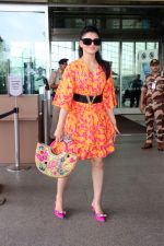 Urvashi Rautela dressed in a pink and orange floral dress spotted at airport on 14 Jun 2023 (7)_6489cf80042b9.jpg