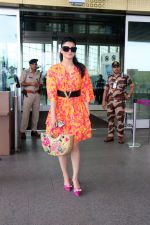 Urvashi Rautela dressed in a pink and orange floral dress spotted at airport on 14 Jun 2023 (8)_6489cf835dfa1.jpg