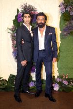 Bobby Deol with son Aryaman Pose for media at the reception of Karan Deol and Drisha Acharya on 18 Jun 2023 (25)_64906774e5807.jpeg