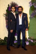 Bobby Deol with son Aryaman Pose for media at the reception of Karan Deol and Drisha Acharya on 18 Jun 2023 (26)_649067766e832.jpeg