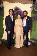 Bobby Deol with wife Tanya and son Aryaman Pose for media at the reception of Karan Deol and Drisha Acharya on 18 Jun 2023 (20)_6490676d25033.jpeg