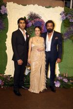 Bobby Deol with wife Tanya and son Aryaman Pose for media at the reception of Karan Deol and Drisha Acharya on 18 Jun 2023 (21)_6490676ea1ffe.jpeg