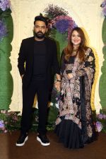 Kapil Sharma with wife Ginni Chatrath Pose for media at the reception of Karan Deol and Drisha Acharya on 18 Jun 2023 (1)_649068095e3a3.jpeg