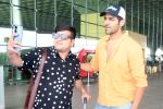 Kartik Aaryan dressed in orange shirt and blue shredded jeans and Dallas Cowboys hat seen at the airport on 25 Jun 2023 (16)_649821b25b6e6.jpg