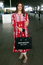 Nupur Sanon seen shinnig in red at the airport holding Saint Laurent handbag on 9 July 2023 (16)_64ac0917353a7.jpg