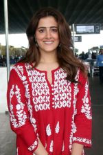Nupur Sanon seen shinnig in red at the airport holding Saint Laurent handbag on 9 July 2023 (4)_64ac092730a84.jpg