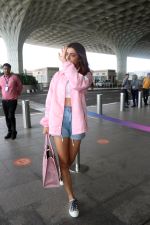 Ruhi Singh seen at the airport in pink jacket and short jeans holding versace handbag on 11 July 2023 (15)_64ad30814f79e.JPG