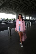 Ruhi Singh seen at the airport in pink jacket and short jeans holding versace handbag on 11 July 2023 (3)_64ad306e20380.JPG