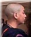 close shot of shabana's bald head