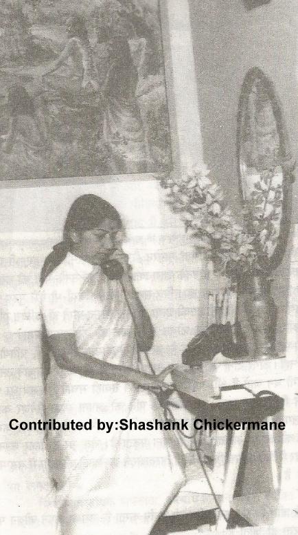 Lata speaking in telephone