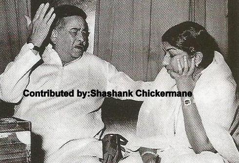 Raj Kapoor discussing with Lata Mangeshkar