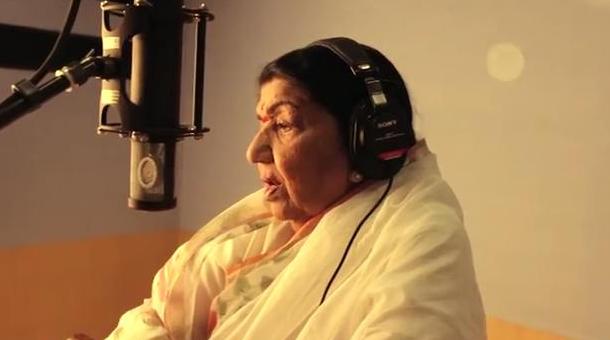 Lata recording a song in the studio