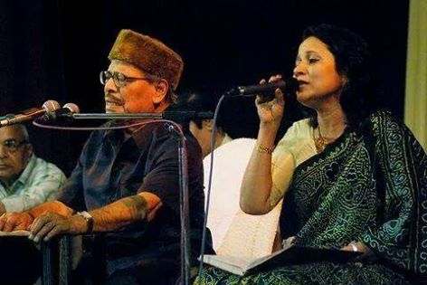 Mannadey with others singing in a concert