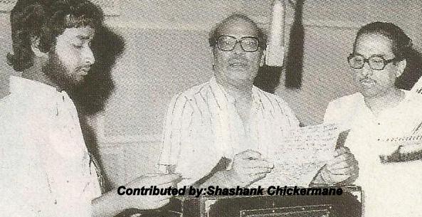 Mannadey recording a song with others