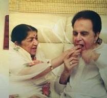 Lata sharing a happy moment with Dilip Kumar