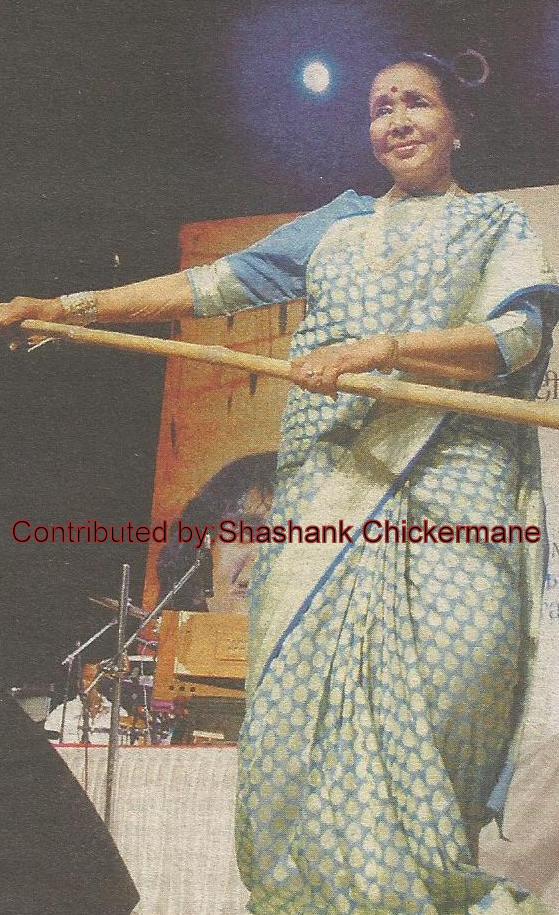 Asha Bhosale performing dance in a stage show