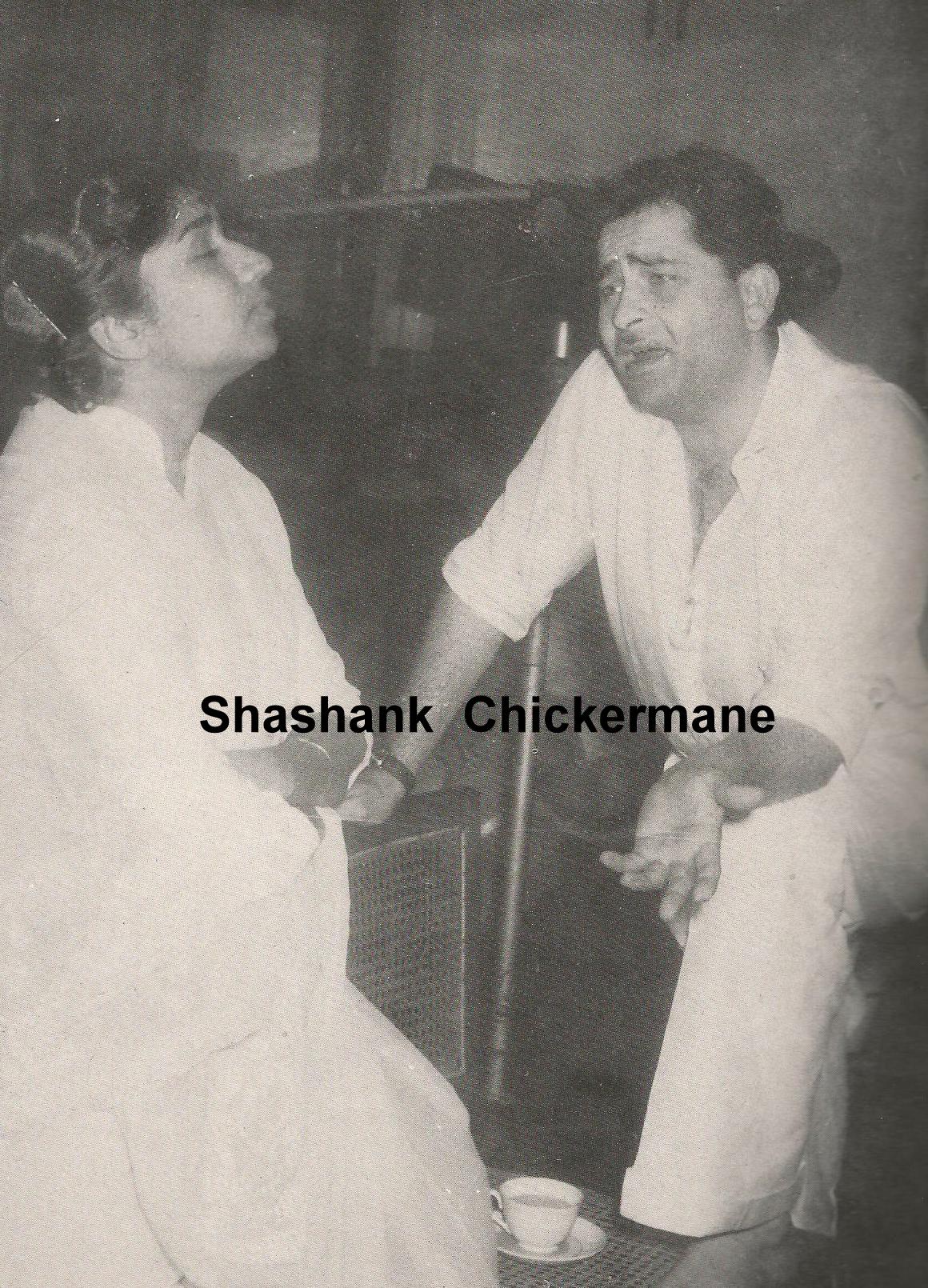 Lata with Raj Kapoor rehearsaling a song in the studio