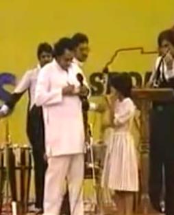 Kishoreda giving autograph to his fan in the stage show