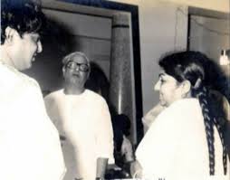 Lata discussing with Majrooh & others in the recording studio