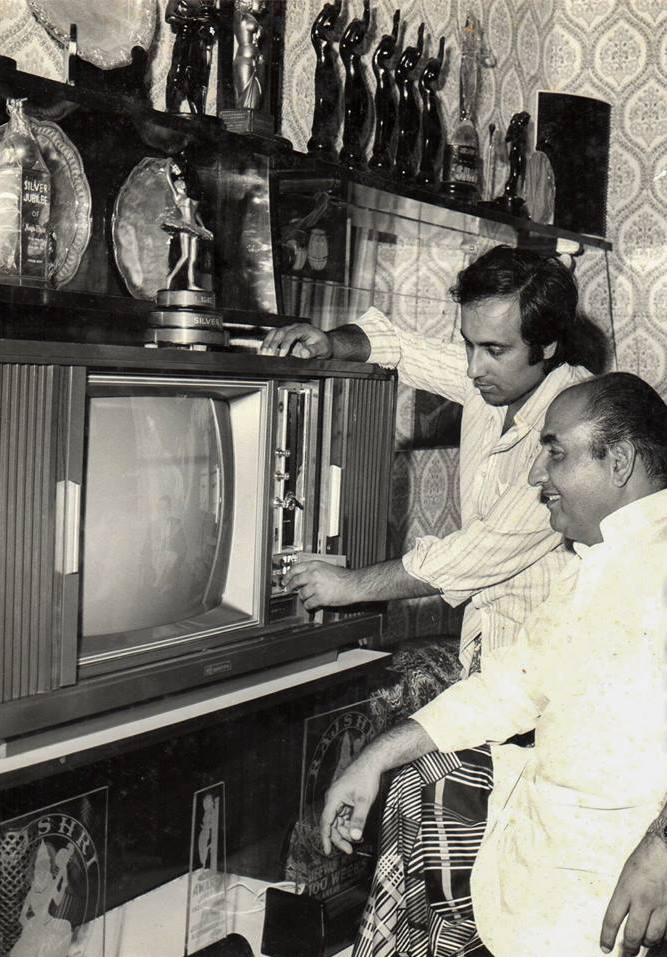 Rafi with his son Rashid Rafi in their house