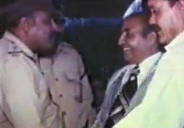 Rafi discussing with police officers