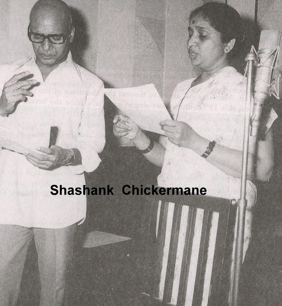 Asha recording a song with Khayyam in the recording studio