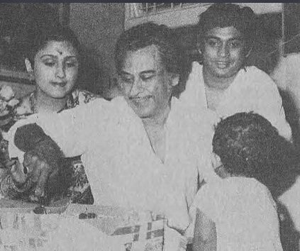 Kishoreda cutting cake in his birthday along with his family