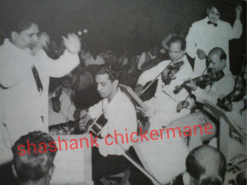 Shankar Jaikishan directing musicians in a song recording