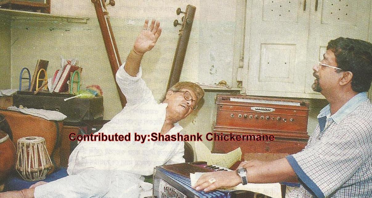Mannadey rehearsalling a song in his house