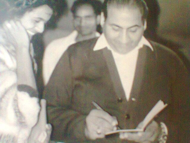 Mohd Rafi giving autograph to his fans