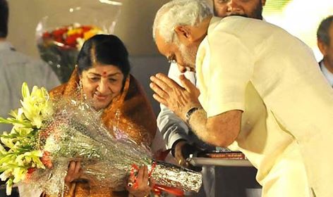 PM Narendra Modi gives bouquet to Lata Mangeshkar in the function 