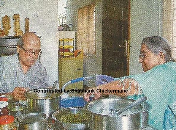 Mannadey with his wife having food at home