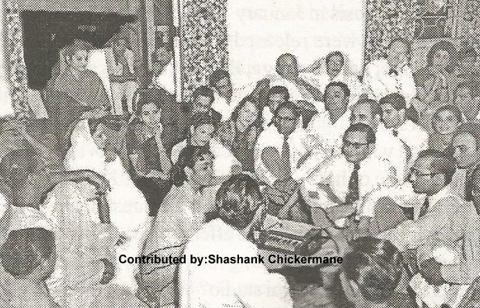 Geeta Dut singing in a mehfil in her house with others