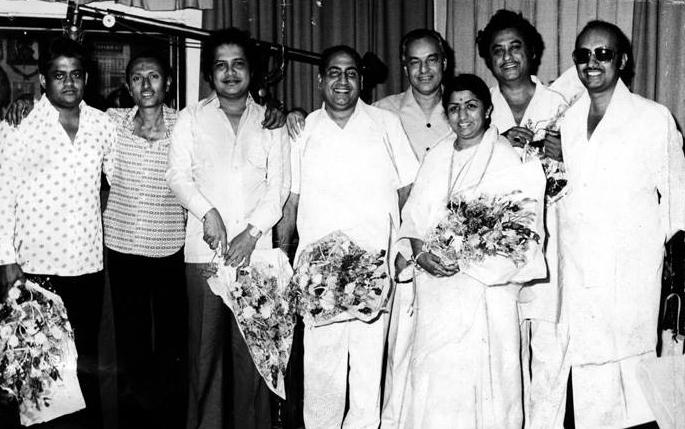 Rafi with Mukesh, Kishoreda, Lata, Laxmikant Pyarelal, Manmohan Desai & others in the recording for the film Amar Akbar Anthony