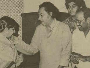 Kishoreda giving cake to Latadidi with Amit Kumar & others