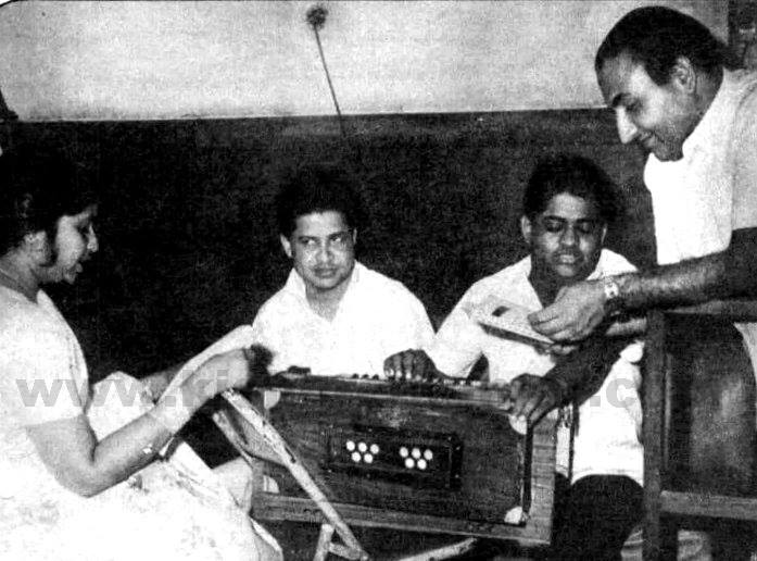 Mohdrafi with Asha Bhosale rehearsalling a song with Laxmikant Pyarelal