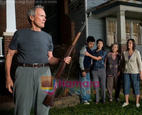 Clint Eastwood, Bee Vang, Ahney Her, Brooke Chia Thao, Chee Thao in still from the movie Gran Torino