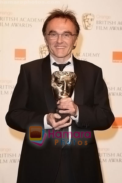 Danny-Boyle-poses-at-the-winner's-board-at-The-Orange-British-Academy-Film-Awards-held-at-the-Royal-Opera-House-on-February-8,-2009-in-London,-England