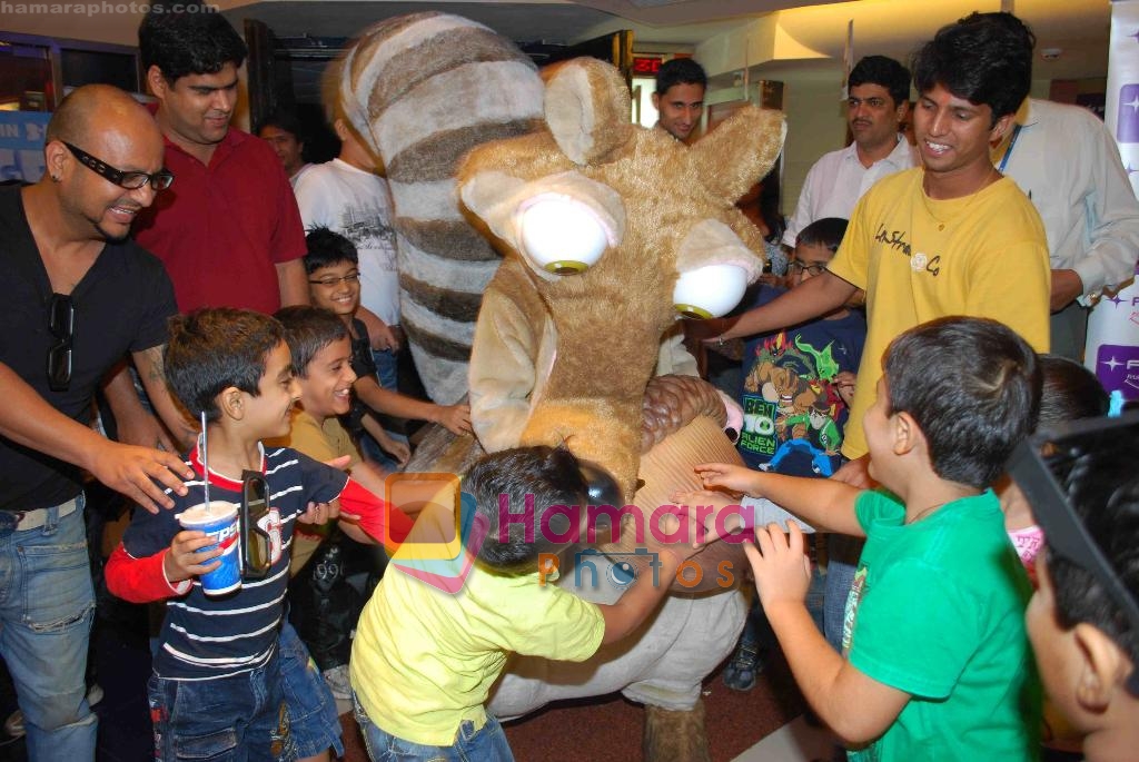 Kids excitedly greeting their favourite Ice Age character _Scrat_ at ICE AGE 2 PREMIERE in Fame, Malad on 1st July 2009