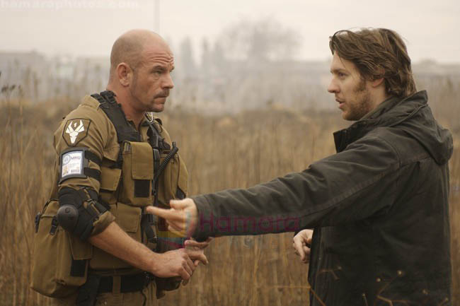 Neill Blomkamp, David James in still from the movie District 9