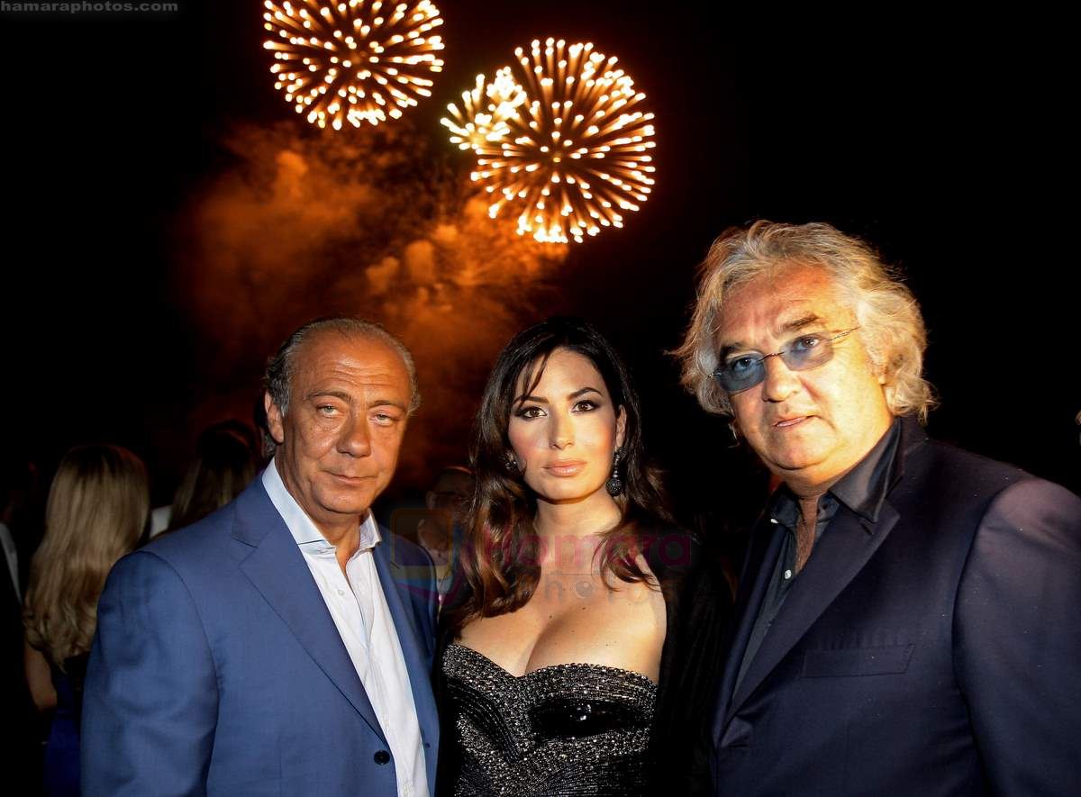 Flavio Briatore, Elisabetta Gregoraci and Fawaz Gruosi attend the de Grisogono CRAZY CHIC EVENING cocktail party at the Hotel Du Cap Eden Roc on May 18, 2010 in Antibes, France 