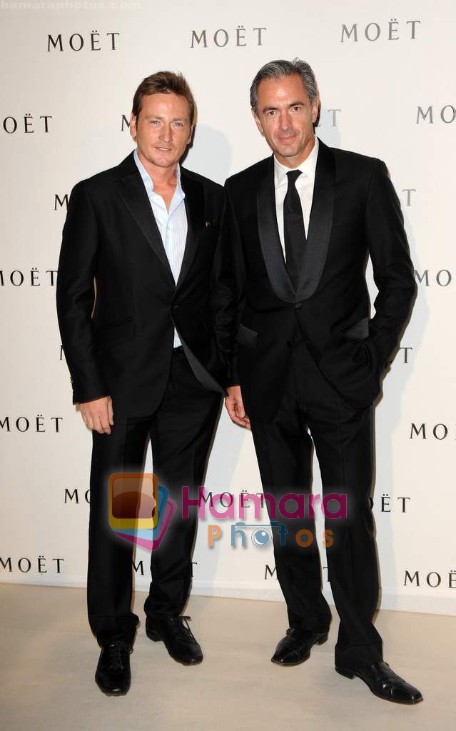 Benoit Magimel shares a moment with Daniel Lalonde at Moet Chandon event
