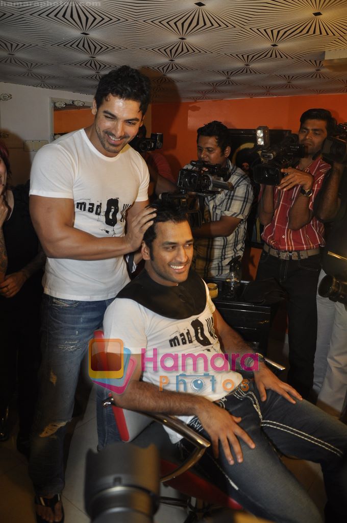 John Abraham,  Mahendra Singh Dhoni style each other at Mad-o-wat salon in Bandra, Mumbai on 4th Dec 2010 