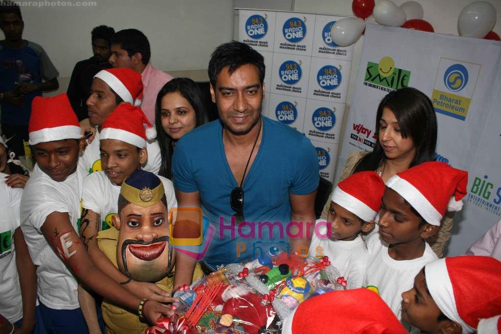 Ajay Devgan celeberates christmas with children in Mid Day Office on 22nd Dec 2010 