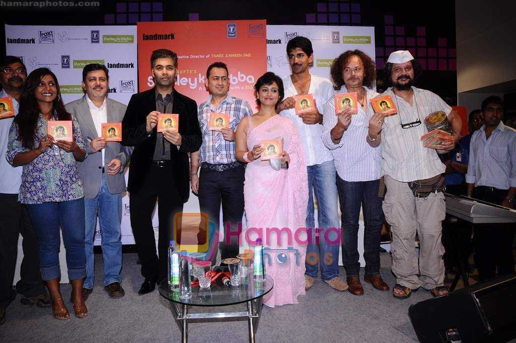 Amol Gupte, Karan Johar, Divya Dutta at the music launch of the film Stanley Ka Dabba in Landmark, Mumbai on 21st April 2011 